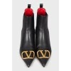 Leather ankle boots with gold logo