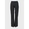 Charcoal trousers with tag