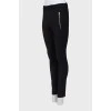 Black trousers with silver zippers