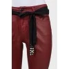 Red trousers with a belt