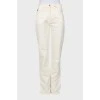 White trousers with tag