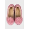Pink ballet shoes decorated with flowers