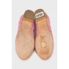 Pink ballet shoes decorated with flowers
