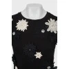 Black T-shirt decorated with flowers