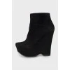 Suede ankle boots with shaped wedge
