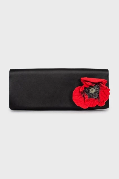 Black clutch decorated with a flower