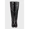 Leather over the knee boots decorated with zipper