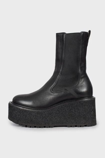 Leather boots with a massive wedge heel