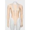 Beige bodysuit with transparent inserts