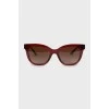 Sunglasses with red frames