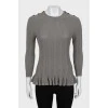 Knitted jumper with ruffled bottom