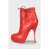 Red ankle boots with perforations