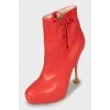 Red ankle boots with perforations