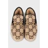 Fur moccasins with signature print
