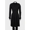 Black trench coat with pleated hem