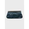 Satin clutch decorated with chain