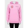 Pink hoodie with brand logo