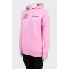 Pink hoodie with brand logo