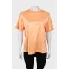 Orange T-shirt with raised seams
