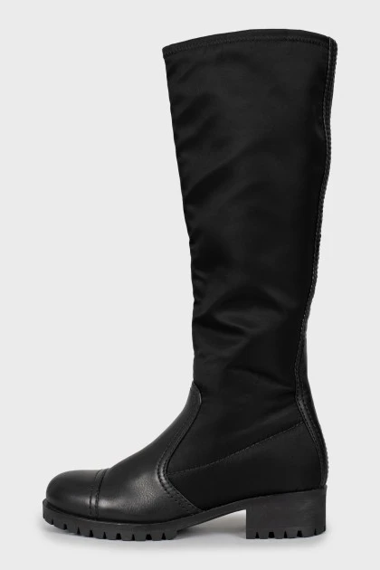 Black boots made of leather and textile