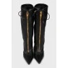 Leather boots with zipper and tag
