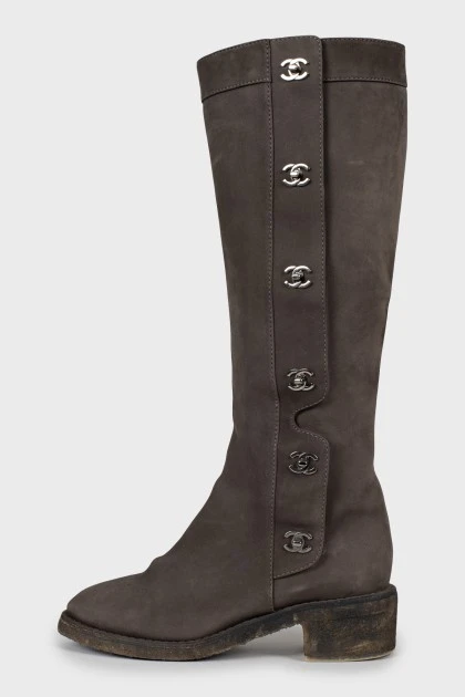Suede boots with metal logos