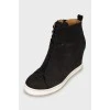 Black sneakers with perforations