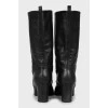 Decorated black leather boots