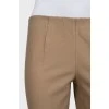 Tapered trousers with elastic