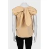 Beige blouse with ties on the back