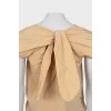 Beige blouse with ties on the back