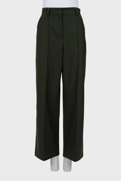 Green trousers with stitched creases