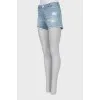 Blue denim shorts with ripped effect
