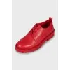 Red oxfords with embossed logo