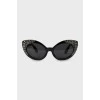 Black sunglasses decorated with rhinestones