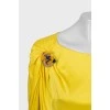 Yellow dress with brooch