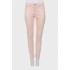 Light pink jeans with gold button