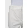 White trousers with stitched creases