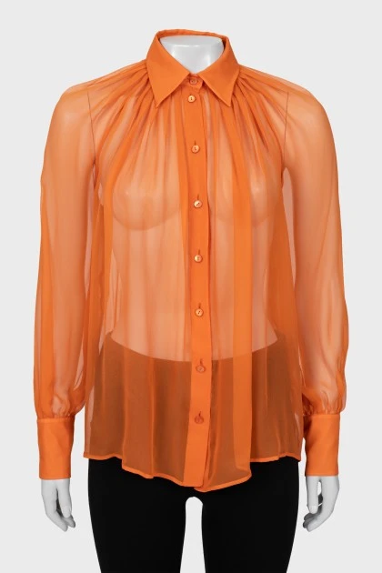 Translucent orange blouse