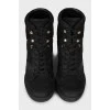 Black leather sneakers with branded embossing