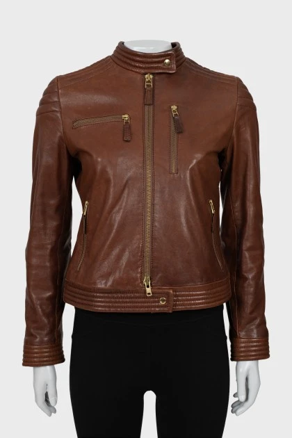 Leather jacket with metal logo on the back