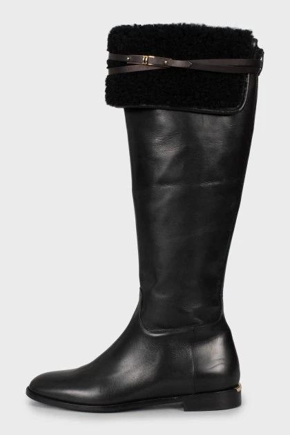 Black leather boots with tag