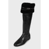 Black leather boots with tag
