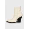 White pointed toe ankle boots