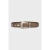 Brown belt with metal decoration