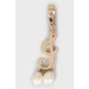 Gold mono earring and pearl necklace