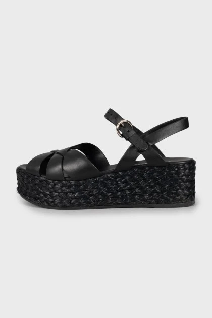 Leather sandals with woven soles