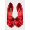 Red shoes decorated with flowers