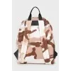 Backpack in military print with tag