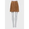 Suede skirt decorated with buttons